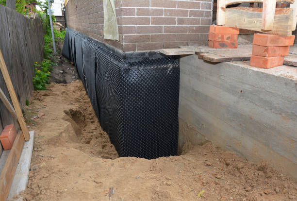 Happy homeowners after waterproofing job in Wyocena
